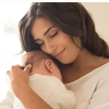 Benefits Of Breastfeeding showing mother with her baby