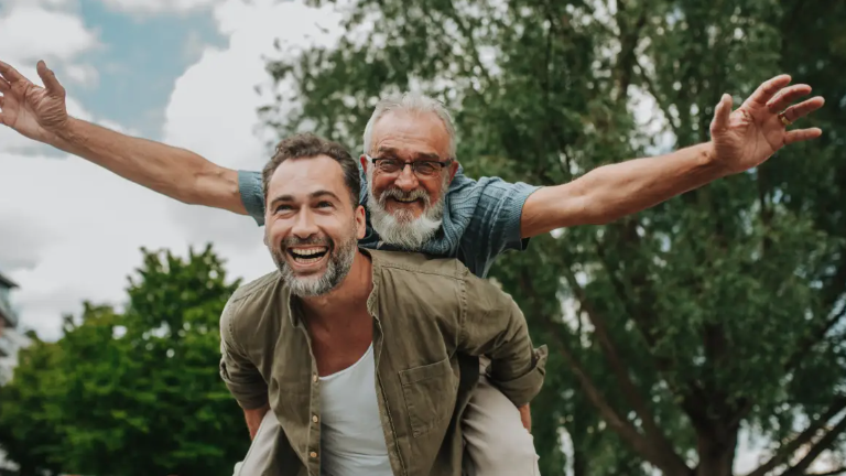 Two Males In Outdoors Setting Aspect Ratio 1600 900