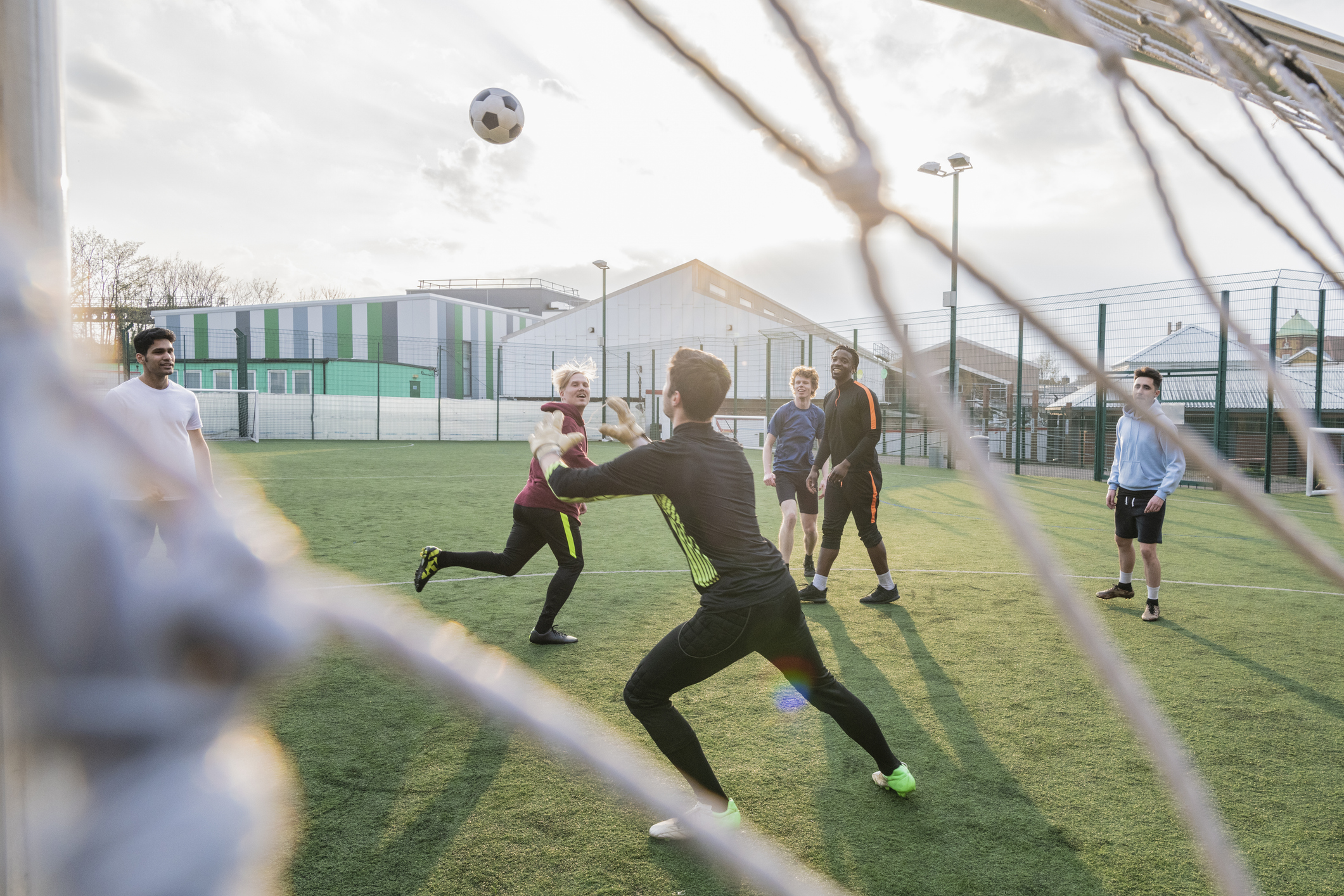 Goalie Catching Ball In Game Of Football