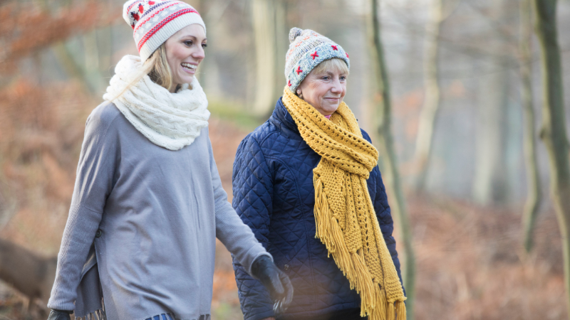 Image Of Two Ladies Walking Outdoors Aspect Ratio 1600 900