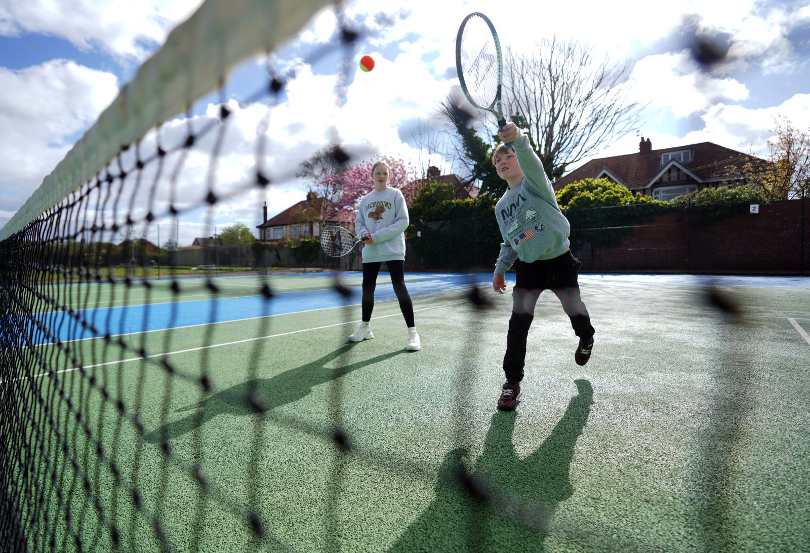 children playing tennis