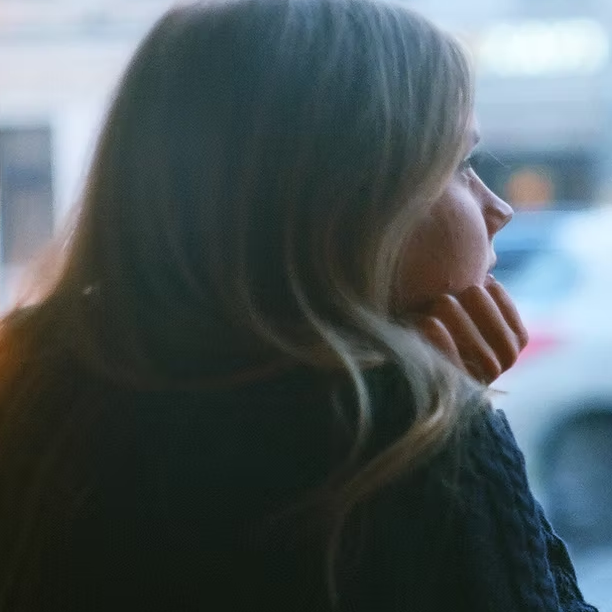 Young Woman Looking Out Of Window Aspect Ratio 1000 1000